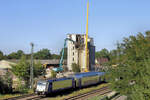 146 517-4 passiert den in Abriss befindlichen Silo der Stader Saatzucht am 13.08.2026 in Tostedt.