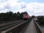 111 187-1 schiebt eine RB Neumarkt(Oberpfalz) ber die Donaubrcke bei Regensburg.