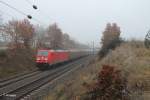 185 375-3 mit ein Gedeckten Gterzug bei Dettenhofen.