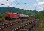 Die 185 274-8 (eine Bombardier TRAXX F140 AC 2) der DB Schenker Rail zieht am 08.06.2013 einen gemischten Gterzug durch Betzdorf (Sieg) in Richtung Kln.