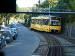 Straßenbahn / Stadtverkehr; Stuttgart Degerloch;   Die  Zacke  ZT 4 Nr.1003 von MAN Baujahr 1983 und Lore 1982, Eigenbau von 1986 in Degerloch am 09.10.2014.
