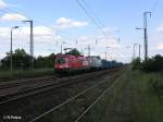 1116 237-7 und W232.04 ziehen ein Sandzug durch Saarmund.