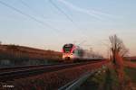 406 fährt als SE25078 Frankfurt/Main - Koblenz zwischen Hattenheim und Erbach dem Sonnenuntergang entgegen.