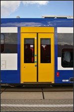 InnoTrans 2016 in Berlin: Seitlicher Fahrtrichtungsanzeige und weitere Anschriften am Pesa Link II f�r die NEB, die sich zur Wagenmitte hin befinden.