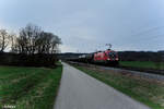 1016 003-4 mit einem Kesselzug in Richtung Passau bei Pölling. 17.03.24