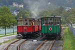 Während Dampflok 4 der Achenseebahn mit ihrem Zug in Richtung Jenbach fährt, schiebt Lok 3 ihren Zug langsam in Richtung Haltestelle Seespitz am Achensee. 22.08.2024  13.11