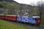 Ge 4/4 II Nr. 623 mit Beklebung für das RhB-Jubiläum auf der Fahrt von Scuol Tarasp nach Disentis am 13.05.2014 kurz hinter der Station Klosters Dorf.
